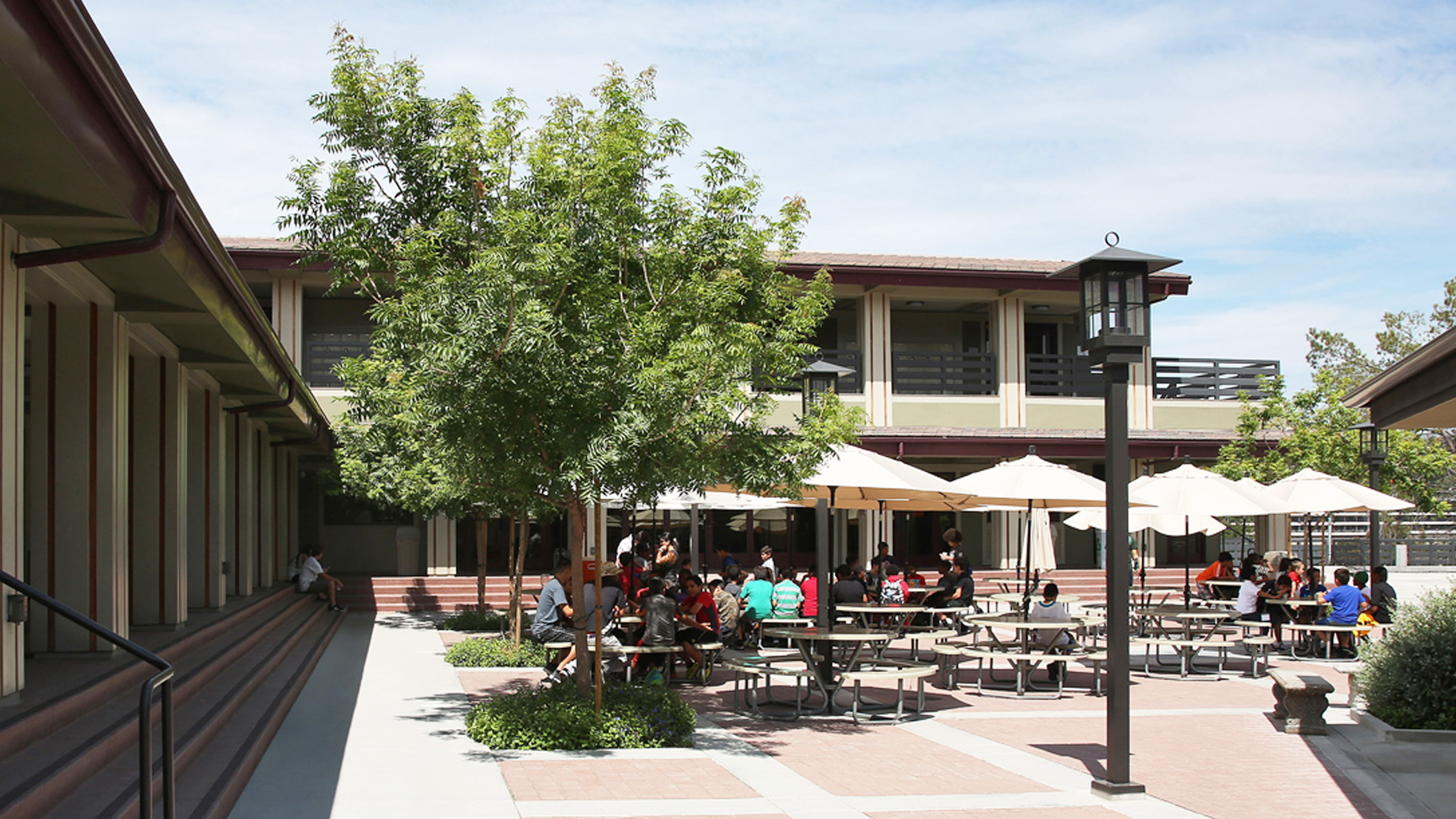An occupied outside lunch area at the Chandler School in Pasadena, an educational architecture project in Southern California.