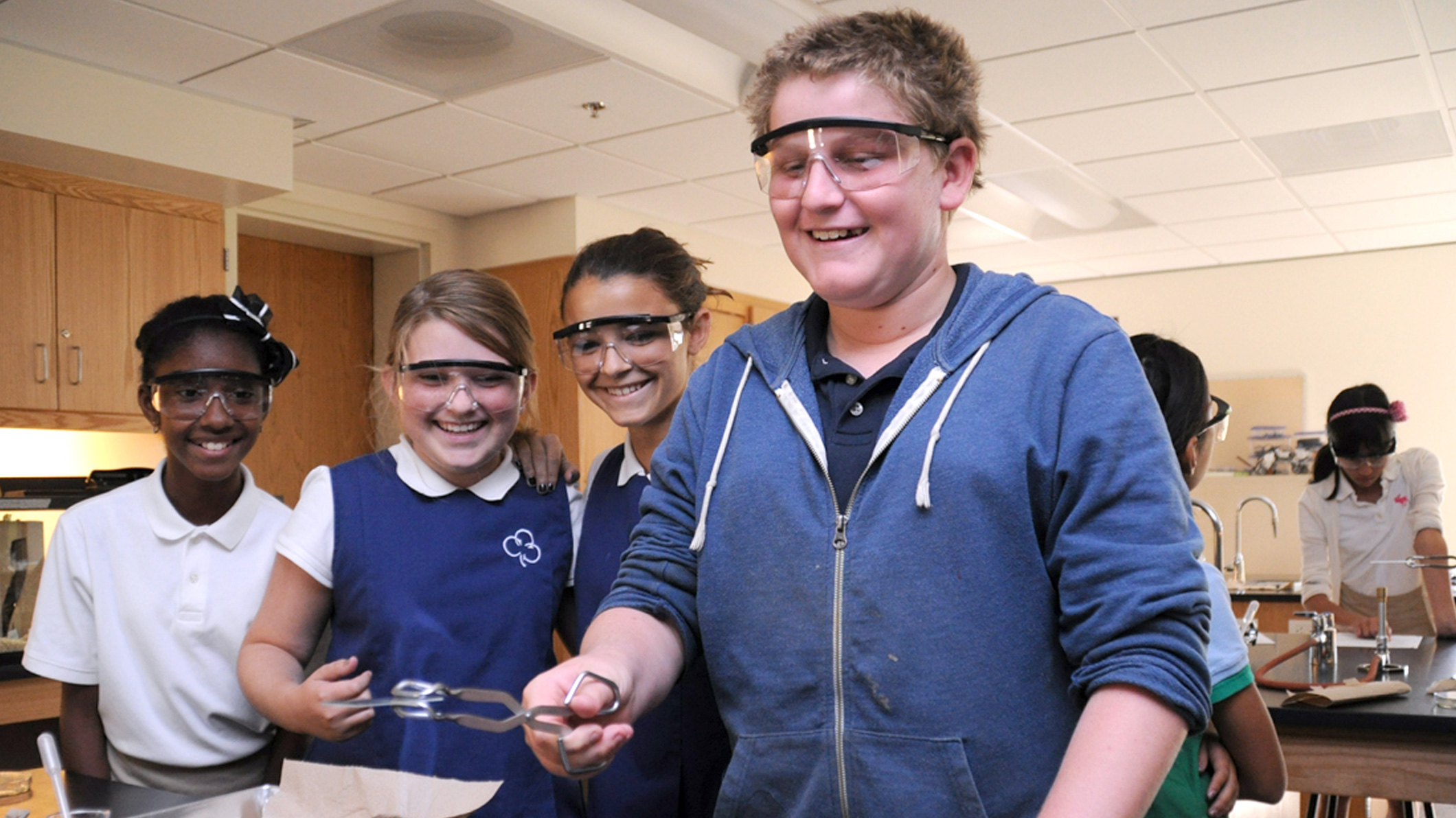 Students perform a chemistry experiment at the Chandler School in Pasadena, an educational architecture project in Southern California.