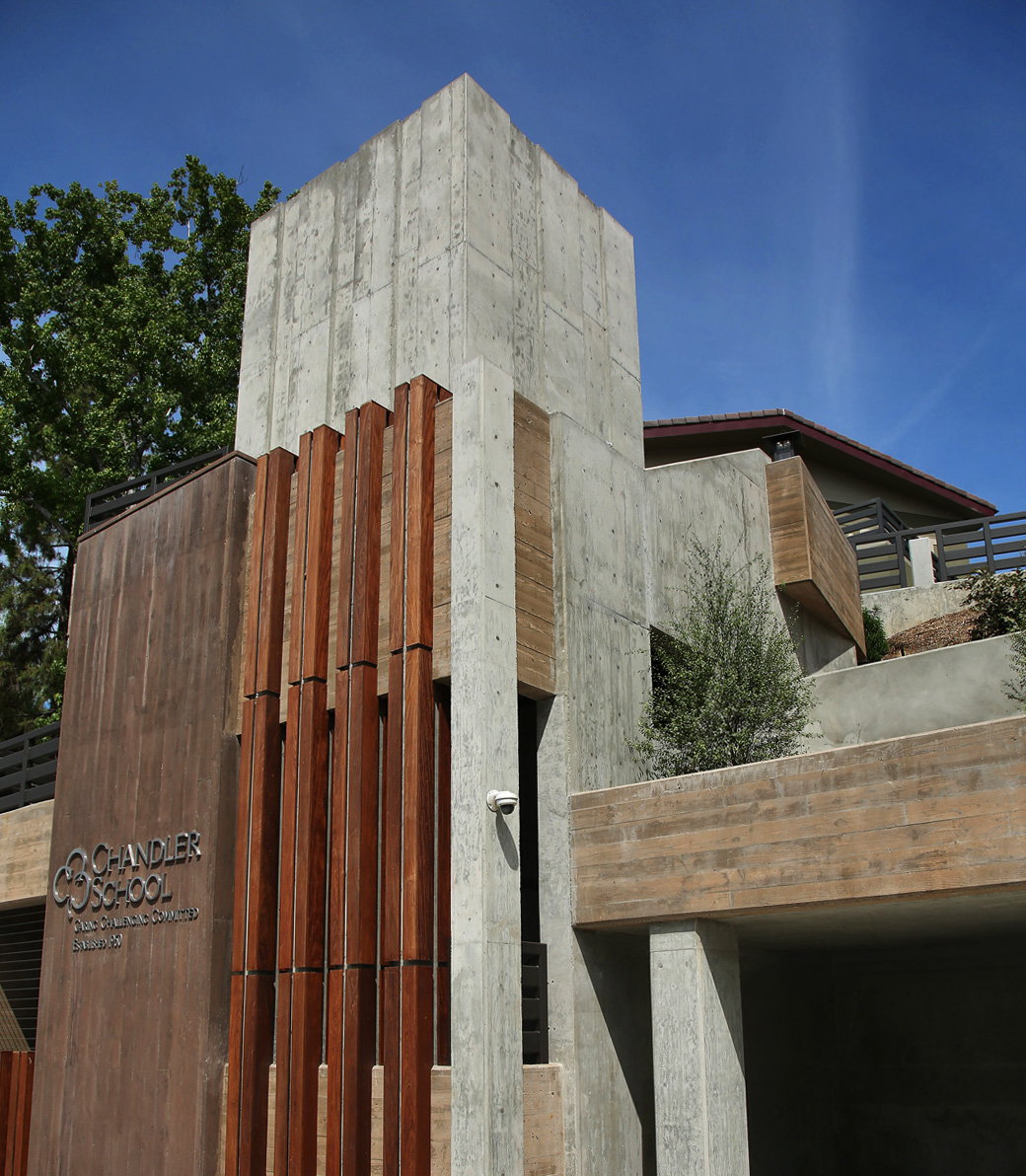 Exterior of the central tower of the new parking structure at Chandler School in Pasadena. A sign on the tower reads: