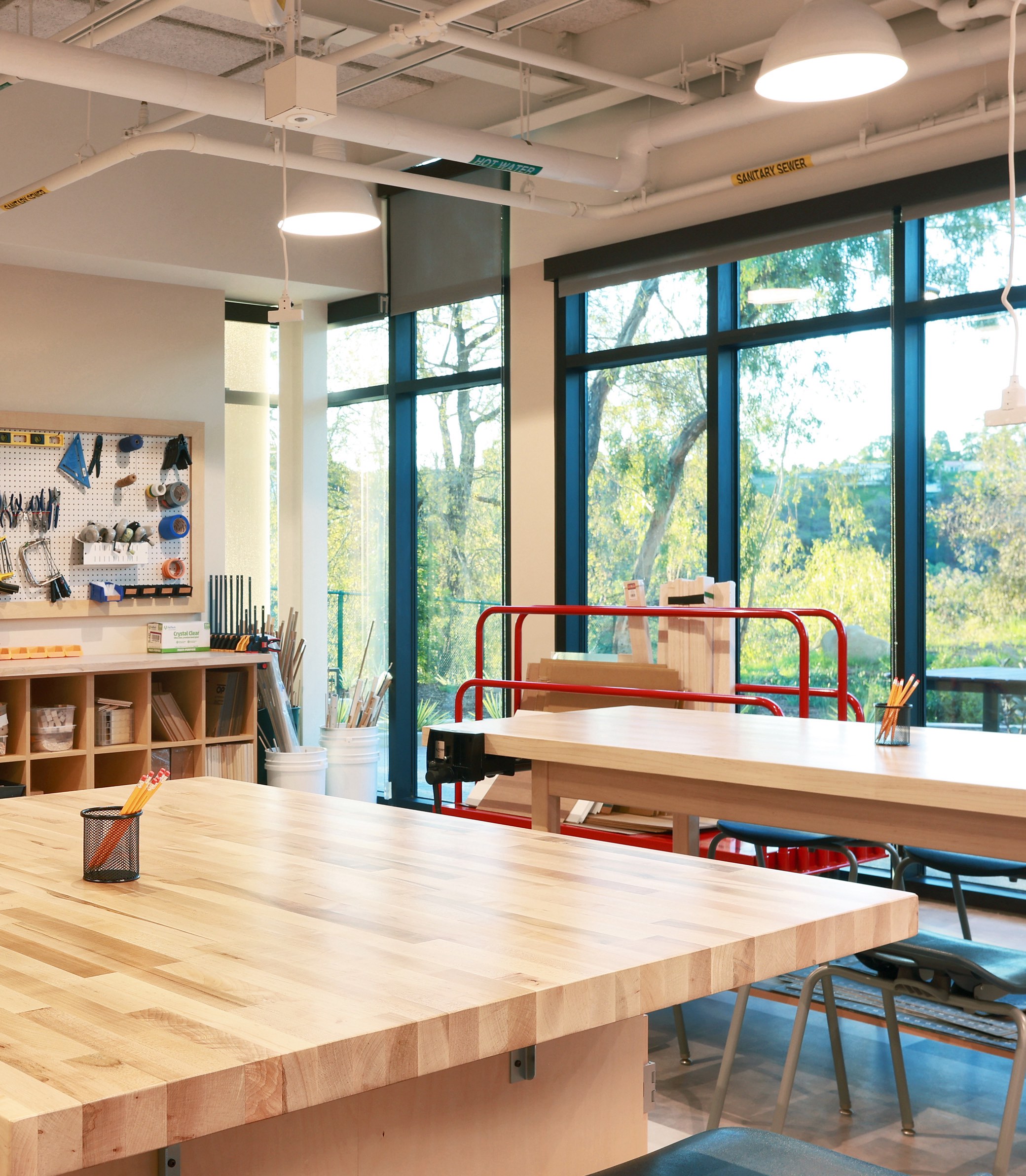 An empty woodworking classroom at the Collaborative Learning and Innovation Center, a Los Angeles educational architectural project by Pica + Sullivan Architects.