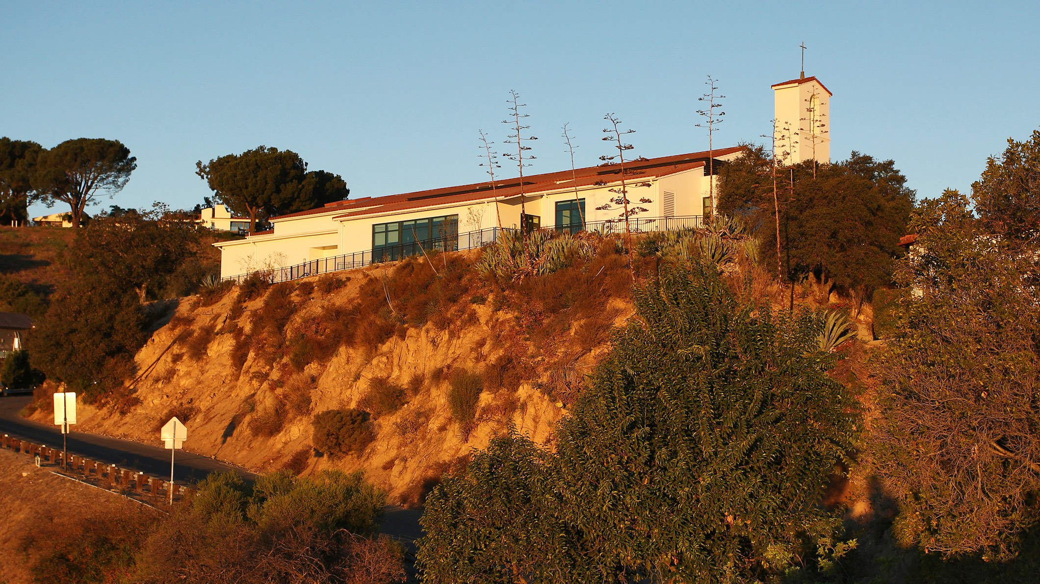 Expanded Mozilo Family Center for the Arts – Pica + Sullivan.com The Mozilo Family Center for the Arts at the Flintridge Sacred Arts Academy, an educational architectural project in Southern California, as seen from the highway behind it at sunset.