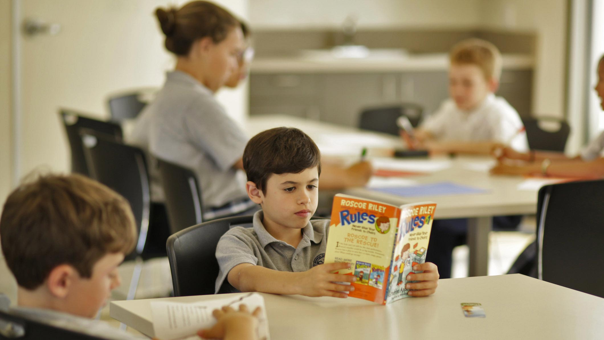 Students read quietly at the Saint Monica Community Center in Santa Monica, a Southern California religious and educational architectural project.