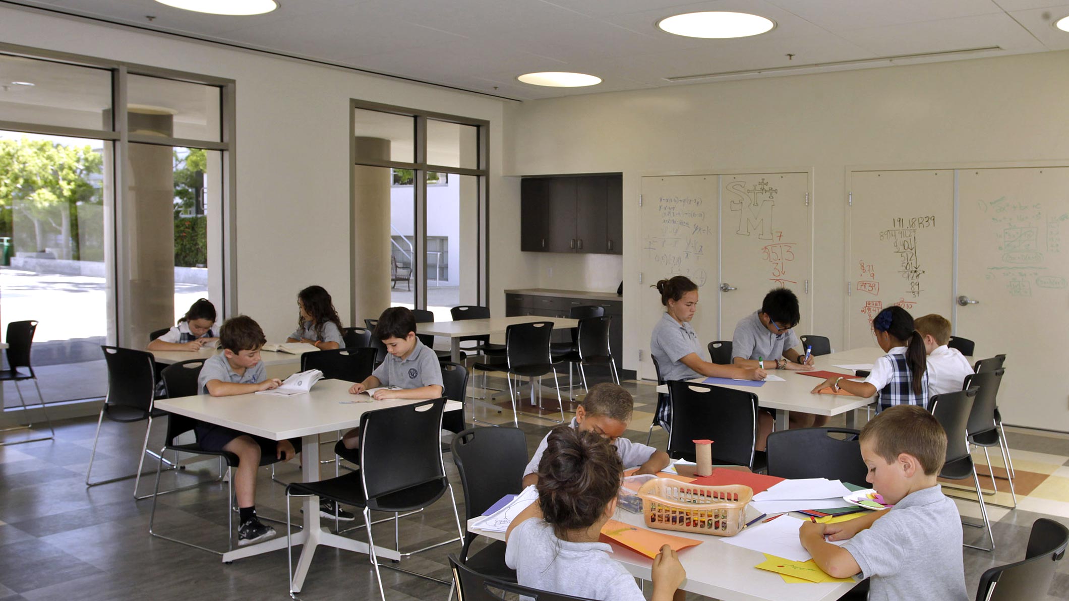 Students work at a classroom at the Saint Monica Community Center in Santa Monica, a Pica+Sullivan Southern California religious and educational architectural project.