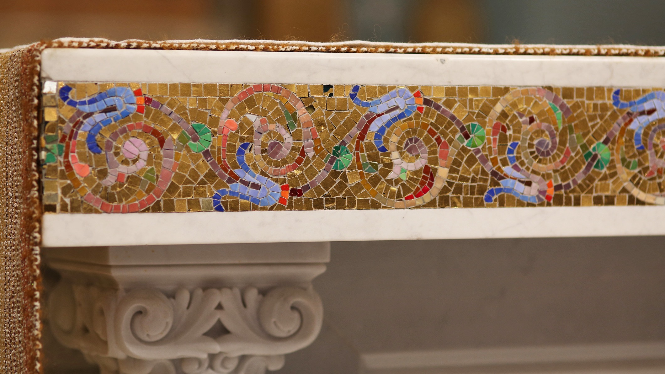 Close-up of decorative mosaic work on an altar at the Saint Monica Church in Santa Monica, a Pica+Sullivan Southern California religious architectural renovation project.