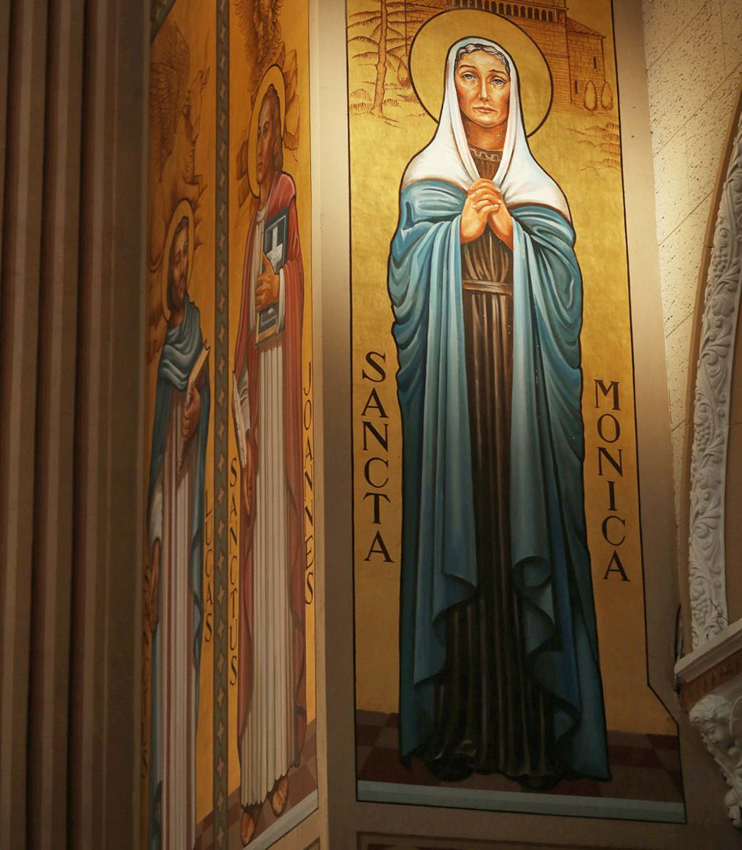 A painted wall image of Saint Monica at Saint Monica Church in Santa Monica, a Pica+Sullivan Southern California religious architectural renovation project.