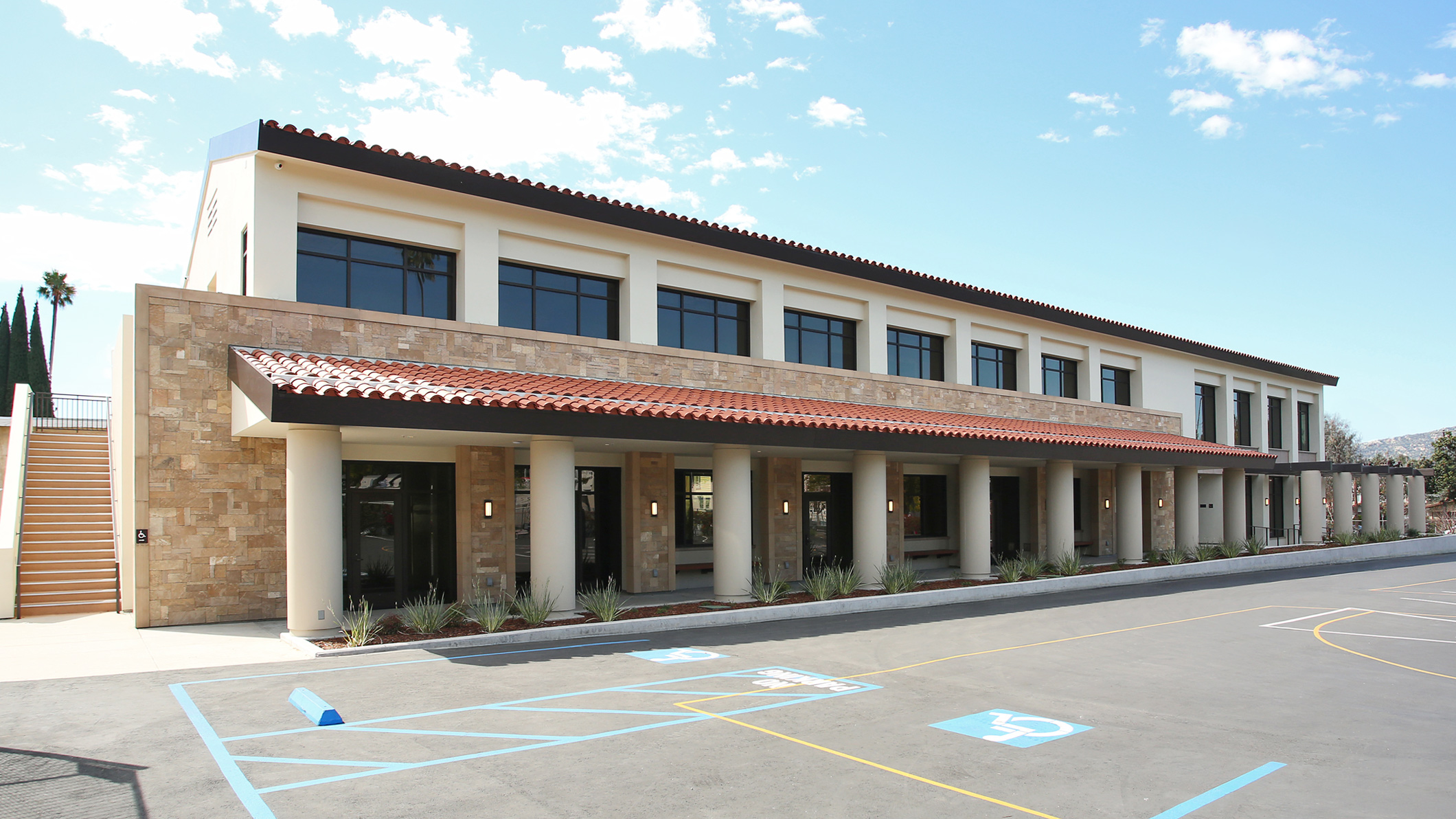 Daytime exterior of Holy Family Church Parish Center in Glendale, a Pica+Sullivan Southern California religious architectural project, from the parking lot.