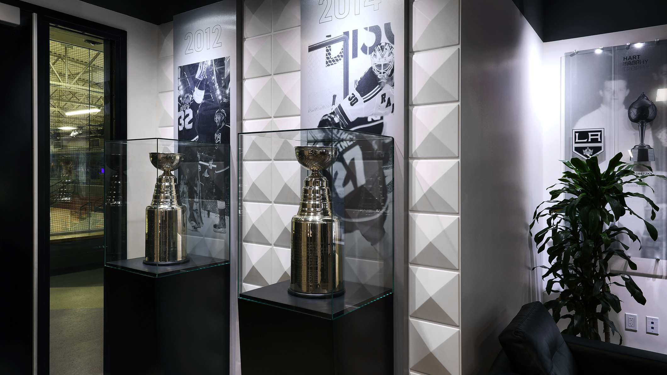 Display room with two Stanley Cups on display in the LA Kings Business Office in El Segundo, a Pica+Sullivan Southern California architectural project.