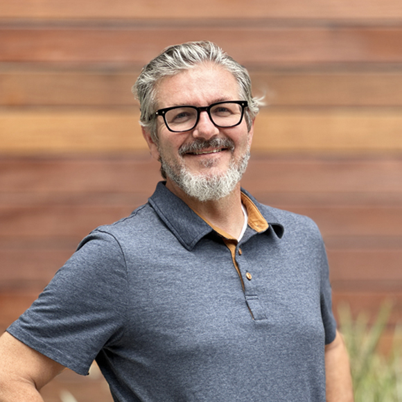 A headshot of Neil Muntzel, Licensed Architect at Pica + Sullivan, a Los Angeles-based non-profit, religious, & educational architecture firm.