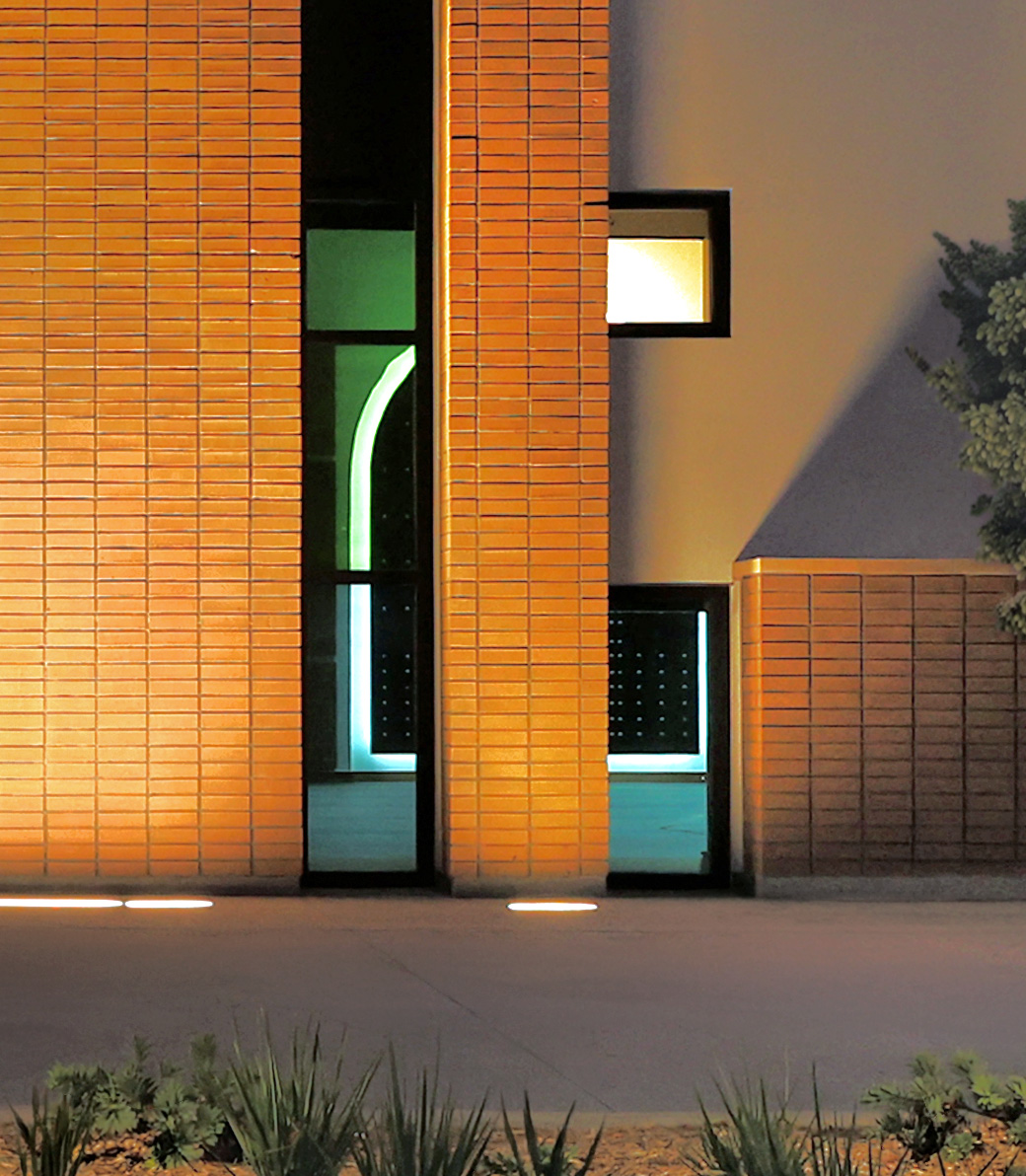 Nighttime exterior at Saint Bede the Venerable Parish Hall in La Cañada Flintridge, a Pica+Sullivan Southern California religious and educational architectural project, focusing on decorative floor-level windows.
