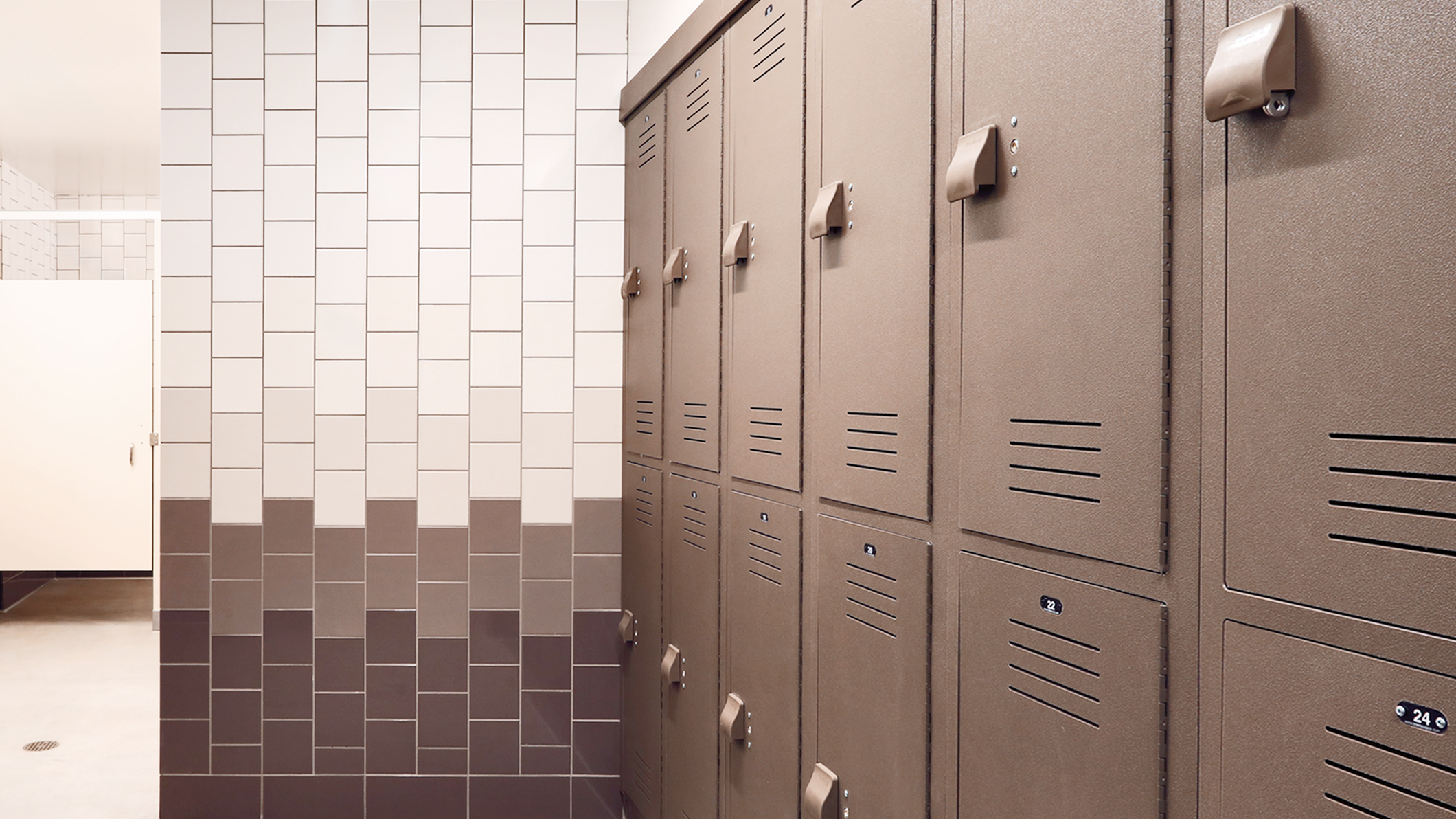 A row of lockers in a locker and changing room at the Robinson Family Aquatics Center at Crespi Carmelite High School in Encino, a Pica+Sullivan Southern California educational architectural project.
