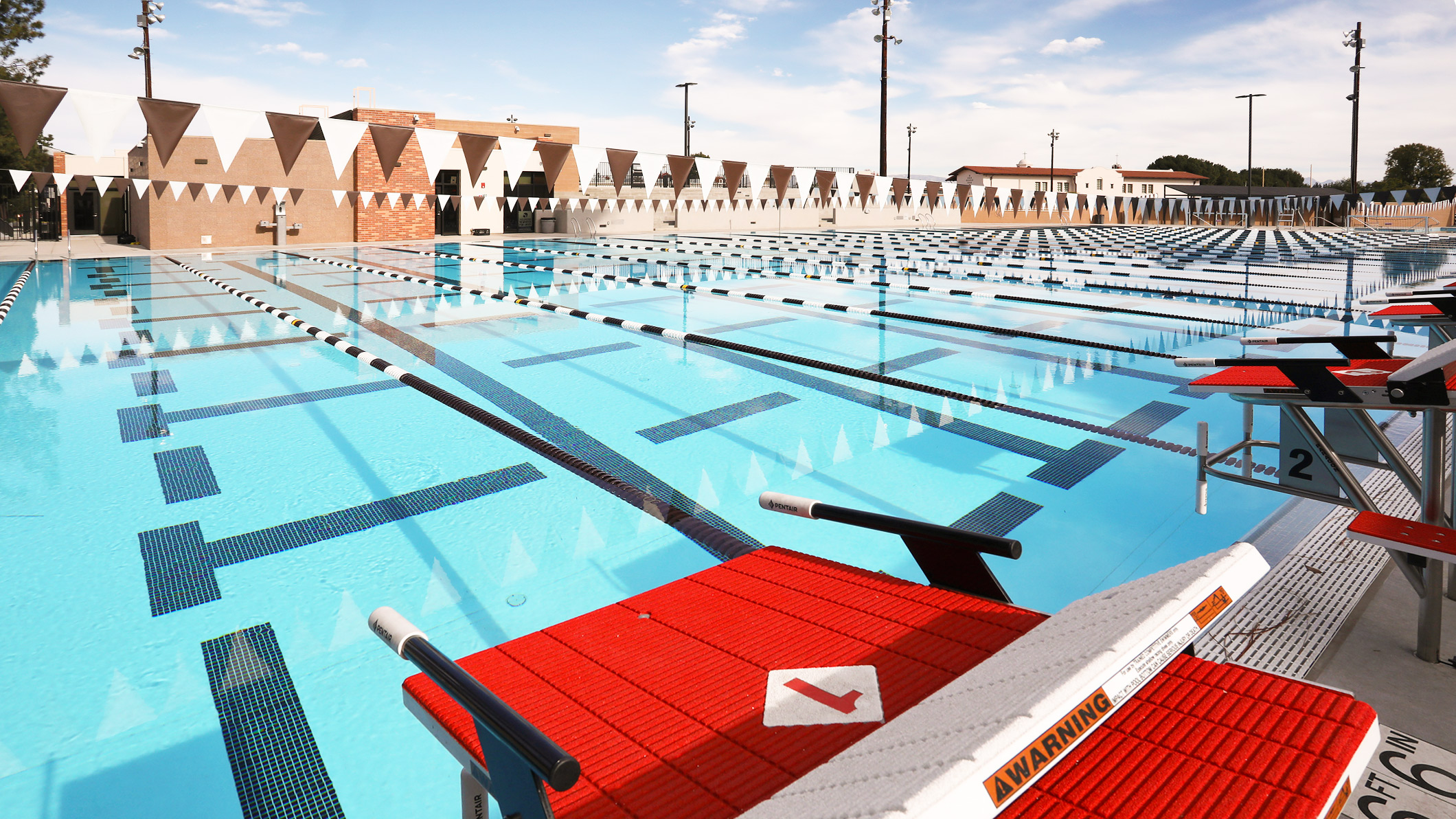 View from the starting race platforms of the pool at the Robinson Family Aquatics Center at Crespi Carmelite High School in Encino, a Pica+Sullivan Southern California educational architectural project.