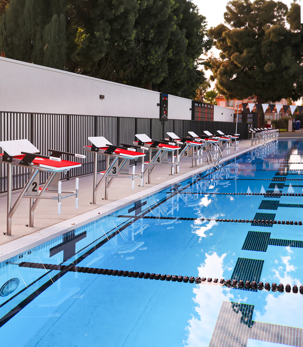 The starting platforms overlook the racing pool at the Robinson Family Aquatics Center at Crespi Carmelite High School in Encino, a Pica+Sullivan Southern California educational architectural project.